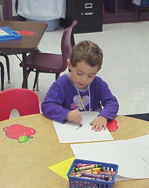 A child at a desk-coloring