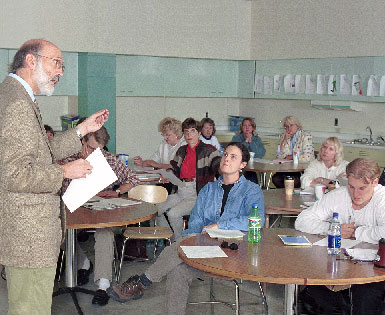 Image of college instructor lecturing in a class