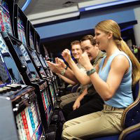 Image of woman winning at casino slot machine